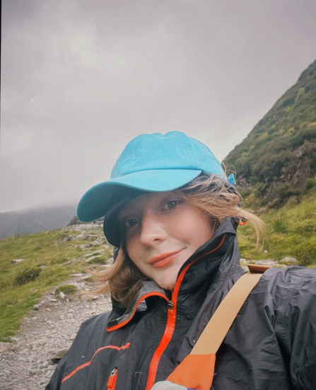 A photo of Alice on a mountainside