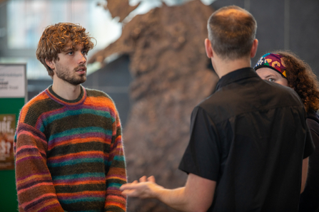 Interns standing in conversation