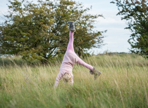 Girl cartwheeling